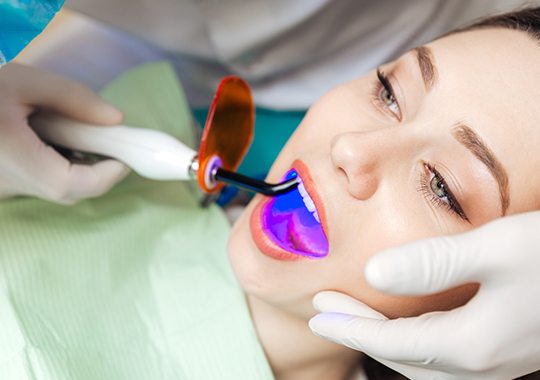 Woman receiving dental sealants