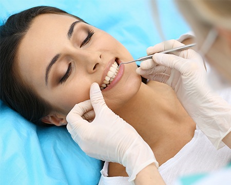 Woman receiving dental exam