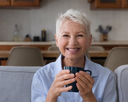 Woman smiling on her couch