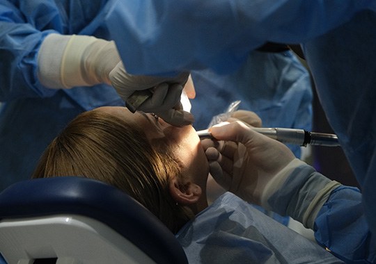 Woman getting oral surgery