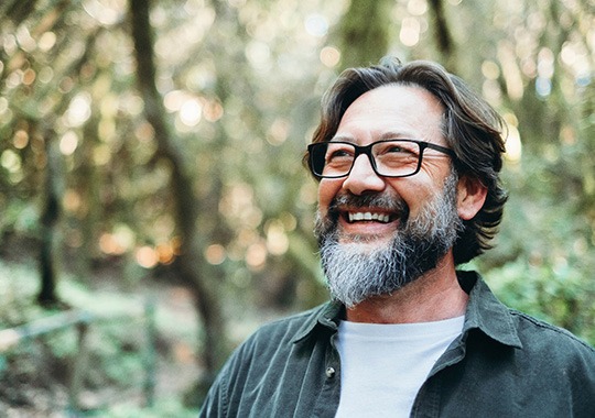 Man smiling outside