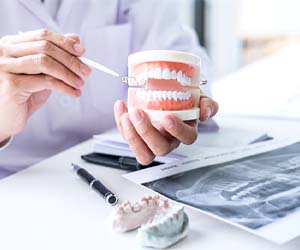 person looking at a denture