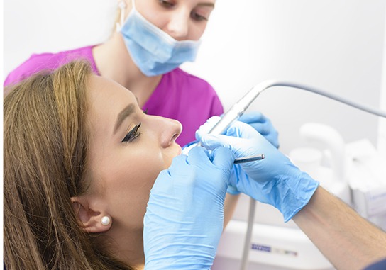 Woman receiving dental treatment