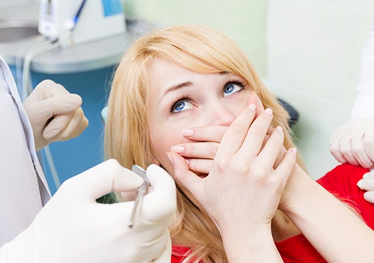 Woman covering her mouth