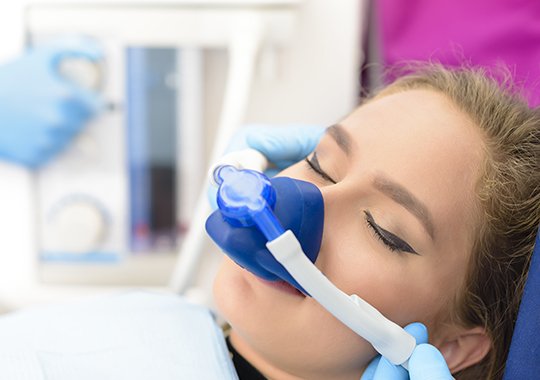 Woman with nitrous oxide nasal mask