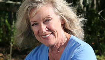 Older woman smiling outdoors