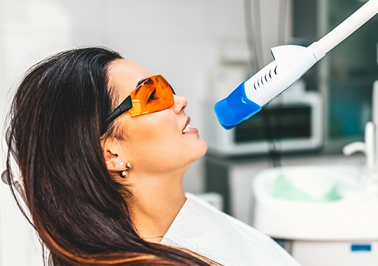 Woman receiving in-office teeth whitening