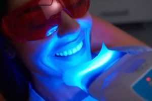 woman getting in-office teeth whitening from her dentist in South Jersey 