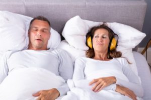 woman frustrated with husband’s snoring