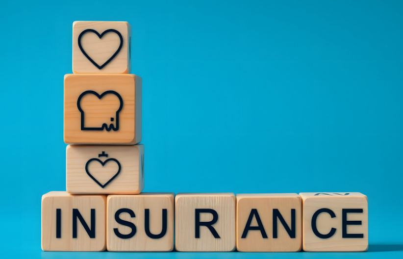 Wooden blocks spelling out the word "insurance"