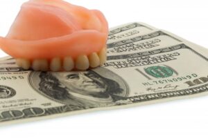 Dentures on top of cash 